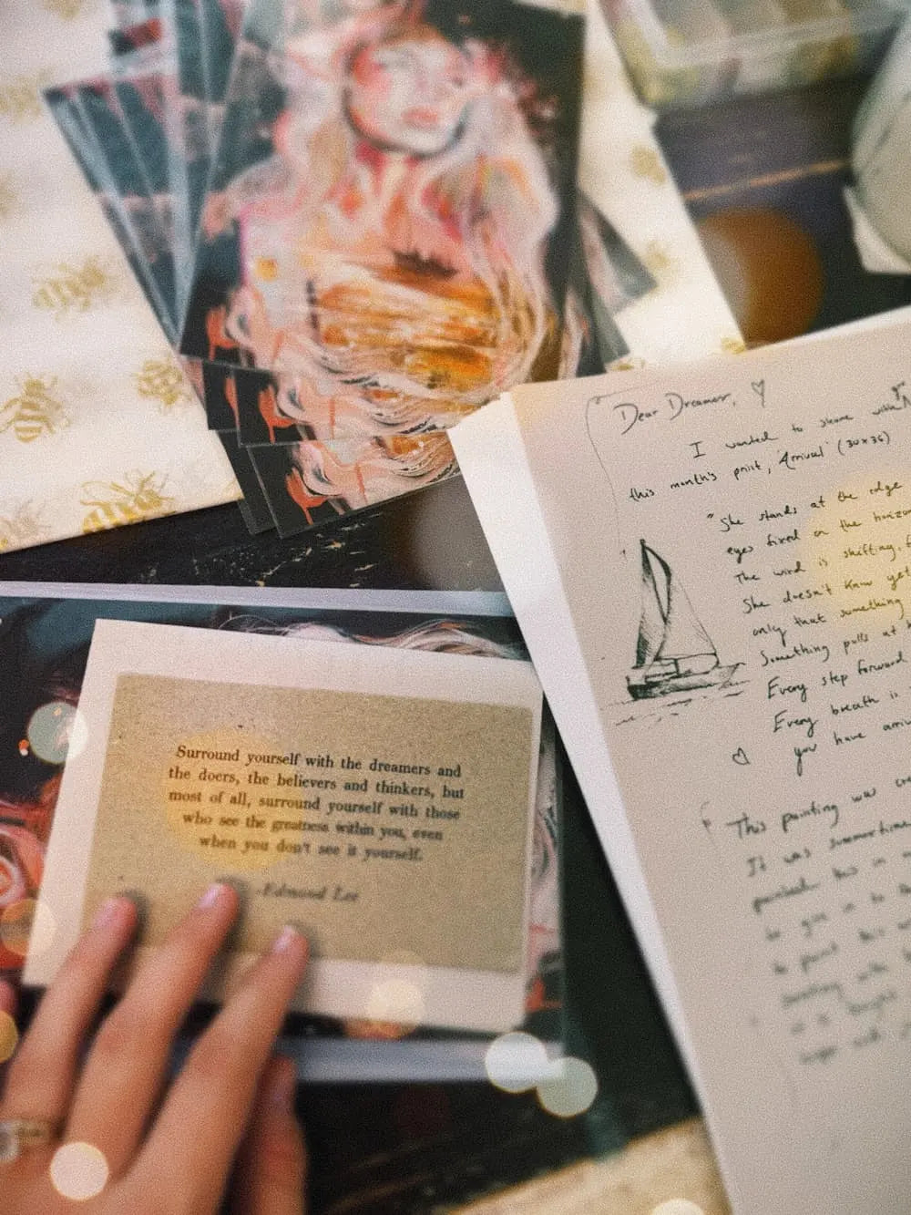 A handwritten letter from Dimitra beside a print
